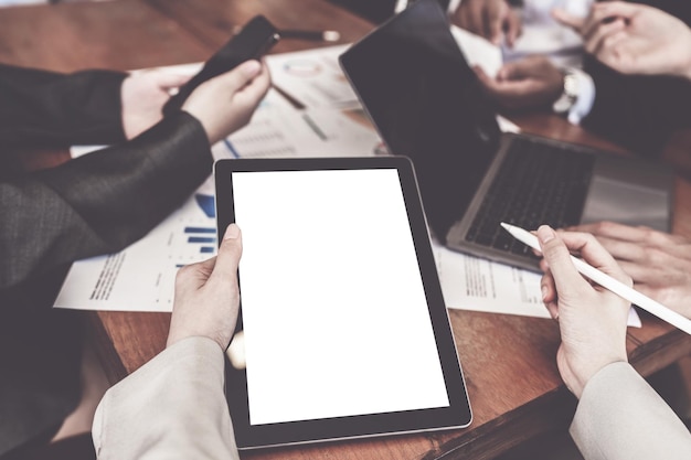 Business person and Accountant using tablet with blank screen at meeting room