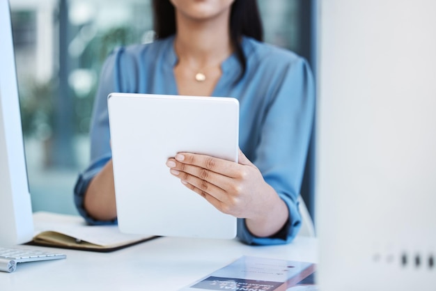 Business person hand and tablet closeup for communication social media or internet in office Entrepreneur woman with tech for network research app internet connection and planning or analytics