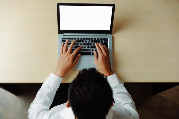 Photo business person worker uses a laptop computer uds