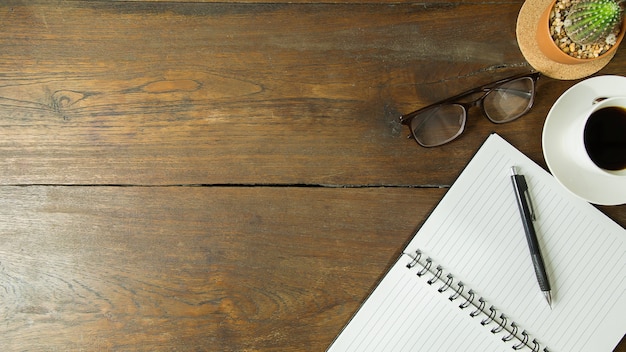 Business person working on wood table flat lay background.