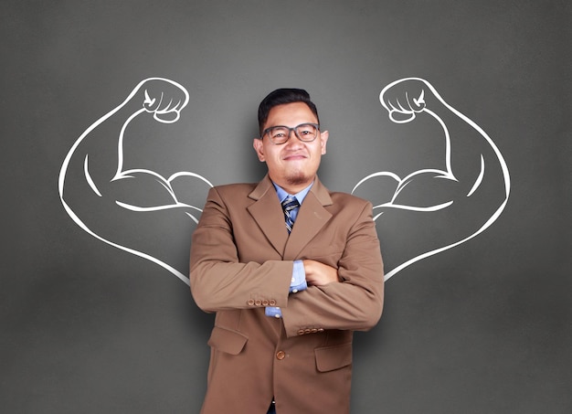 business power concept young asian businessman smiling with strong powerful arms