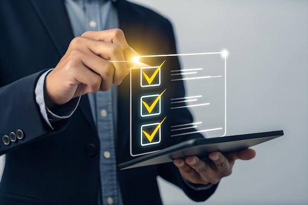 Business professional using a digital checklist for planning and success
