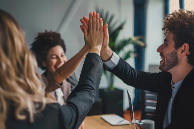 Photo business professionals celebrating teamwork with high five