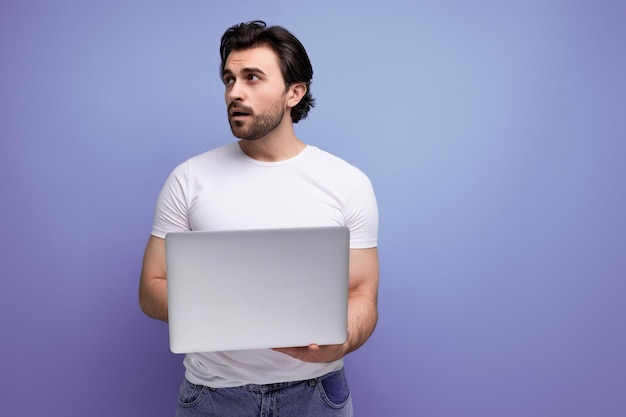 Business remote worker man with laptop in studio