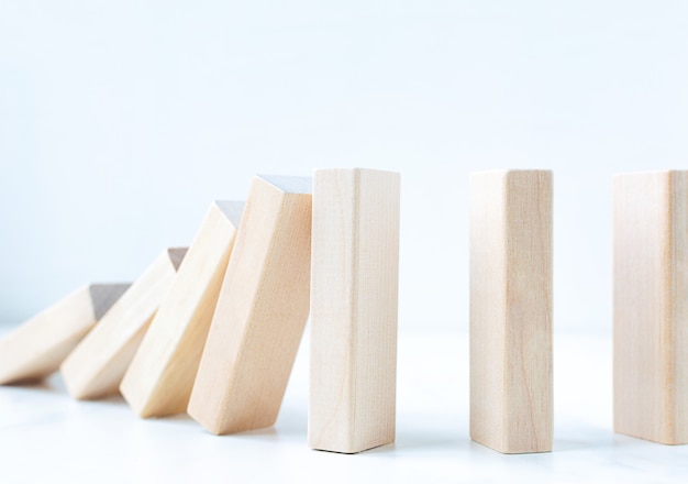 Business risk control imbalance concept on wooden blocks with\
copy space.