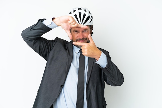 Business senior man with a bike helmet isolated on white background focusing face. Framing symbol