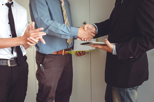 business shaking hands. business executives to congratulate the joint.