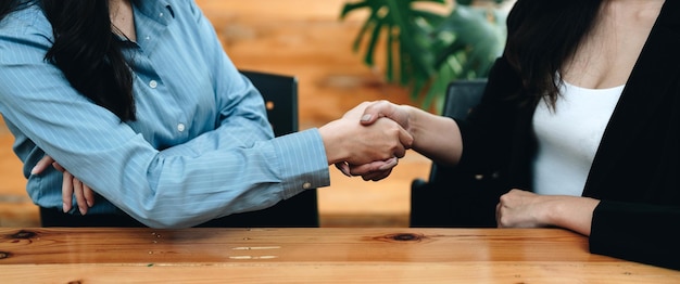 Business shaking hands finishing up meeting Successful businessmen handshaking after good deal