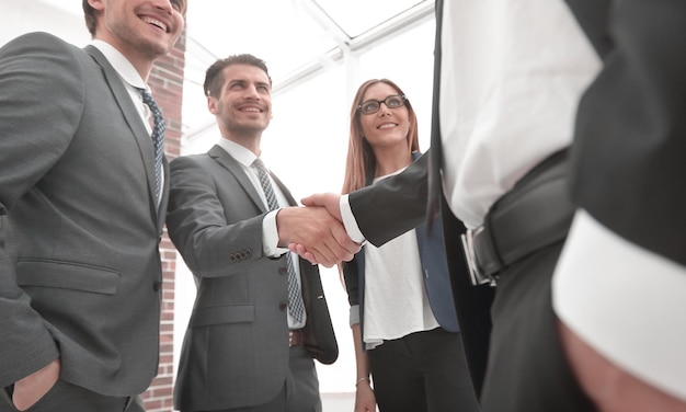 Business shaking hands in the office