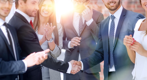 Business shaking hands with business partner the concept of teamwork