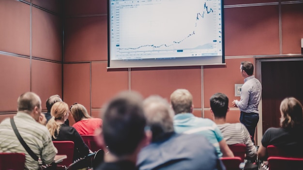 Business speaker giving a talk at business conference meeting event