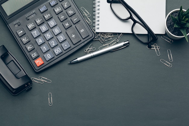 Business still life with calculator on table in office.