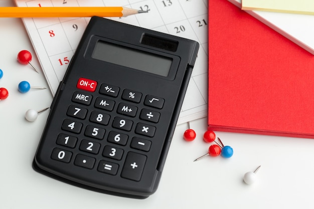 Business still life with calculator on table in office.