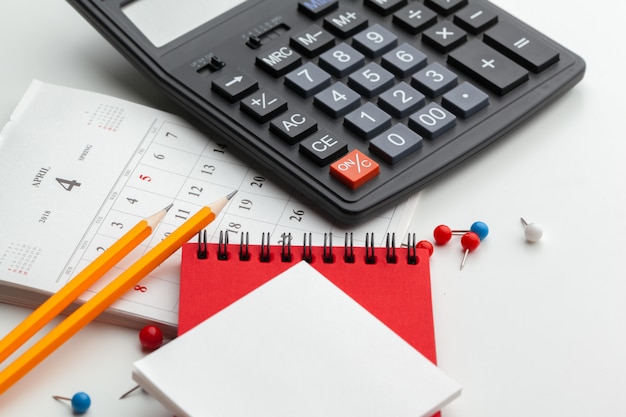 Business still life with calculator on table in office.