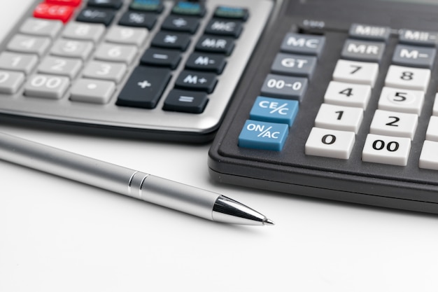 Business still life with calculator on table in office.