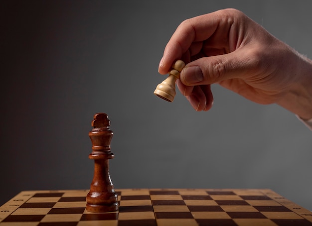 Business strategy concept. Pawn making final last step to make checkmate in chess.