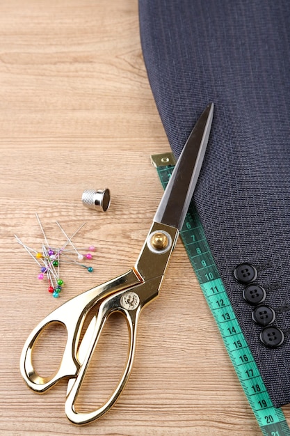 Business suit tailoring on wooden background