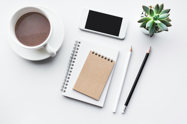 Business table top with mock up office supplies on white background