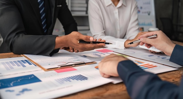 Business team analyzing income charts and graphs in office Close up Business analysis and strategy concept