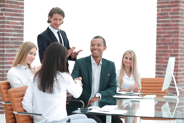 Business team applauding business partners after signing the contract