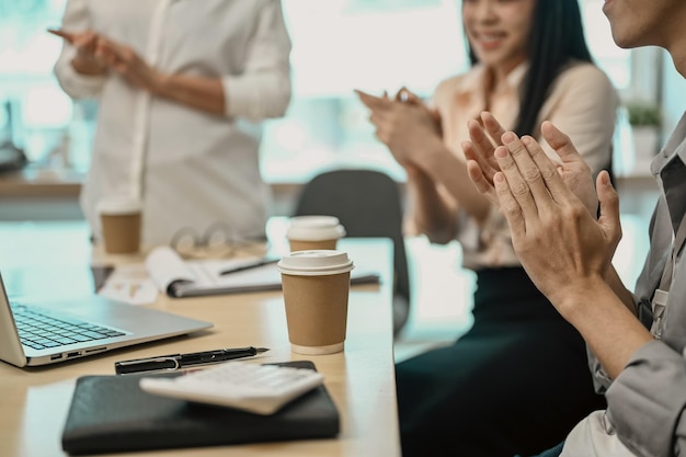 Business team applauding during a seminar in the conference room