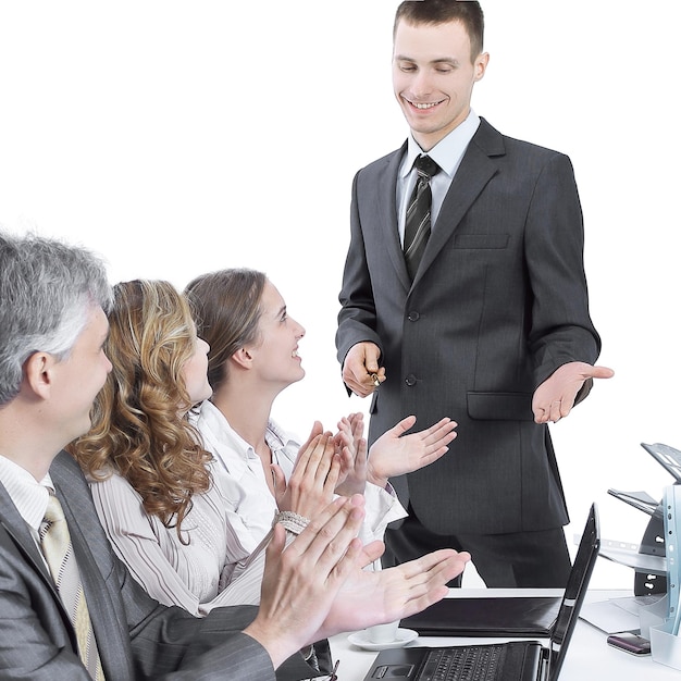 Business team applauding the speaker at a business presentation