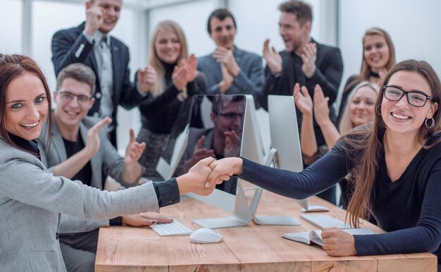 Business team applauding at a work meeting