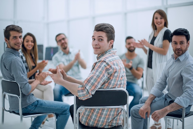 Business team applauds the speaker at the workshop success concept