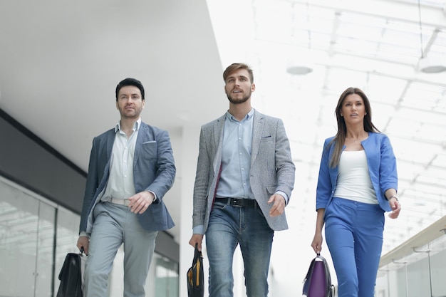 Business team are walking in the spacious hall business background