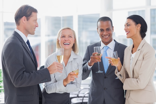 Business team celebrating with champagne