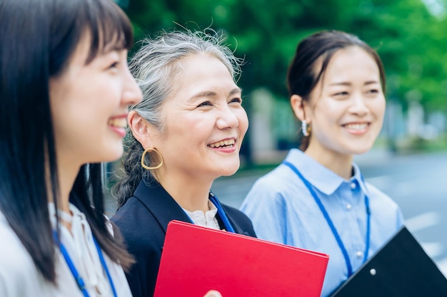 A business team centered on grayhaired woman