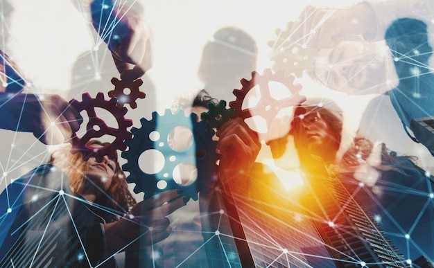 Business team connect pieces of gears Teamwork partnership and integration concept with network effect double exposure