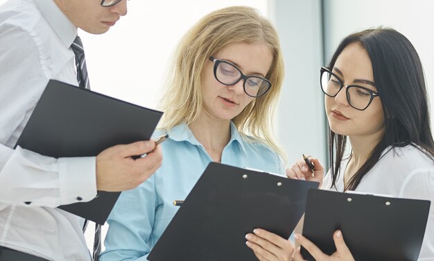 Business team discussing business documents before starting negotiations . business concept