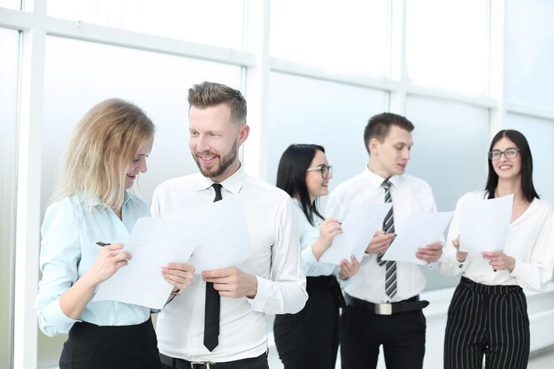 Business team in discussing business documents standing in the office