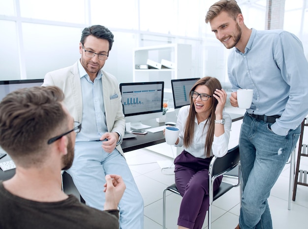 Business team discussing news during coffee break