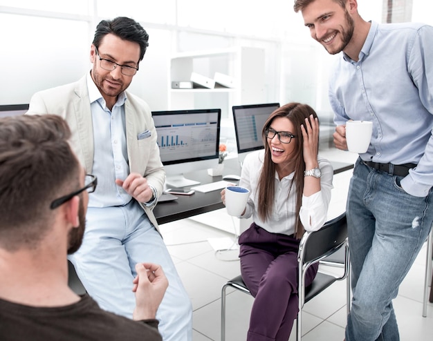 Business team discussing news during coffee break