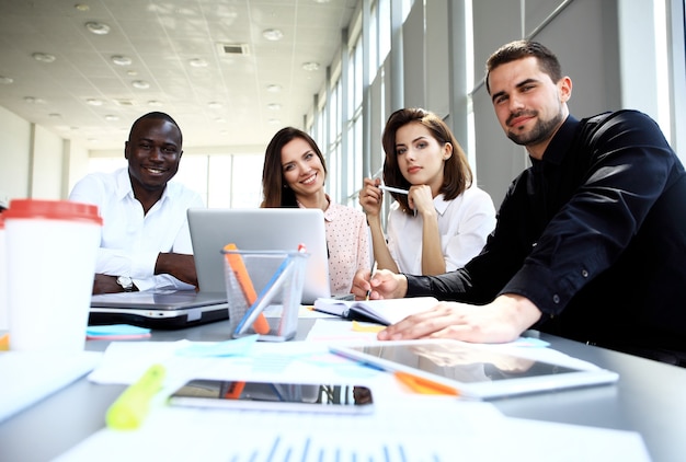 Business team discussing together business plans in office