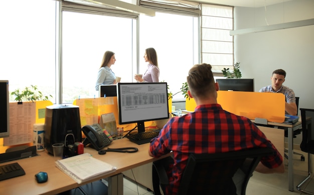 Business team discussing together business plans in office