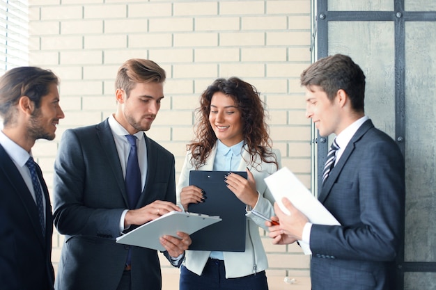 Business team discussing together business plans in office