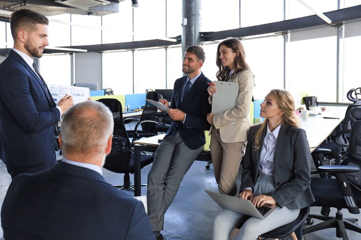 Photo business team discussing together business plans in office.