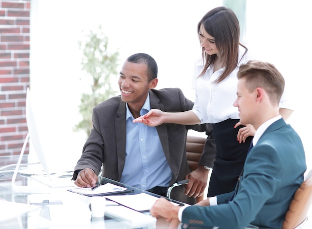 Business team discussing work problems sitting at their Desk