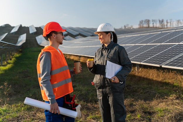 Business team of engineers discussing efficient plan of\
construction energy batteries