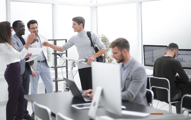 Business team giving each other high fivethe concept of mutual understanding