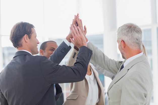 Business team high fiving