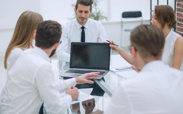 Business team holds a meeting in a bright officethe concept of teamwork