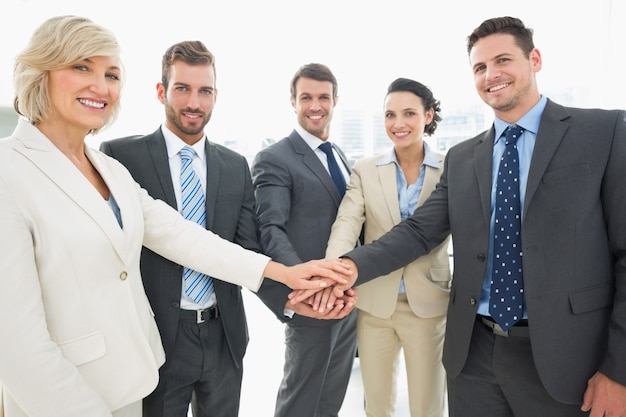 Business team joining hands together