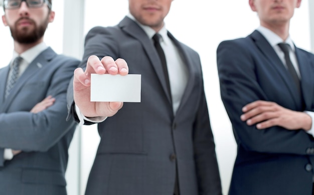 Business team leader showing business card