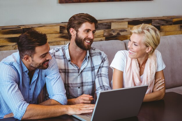  Business team looking at laptop