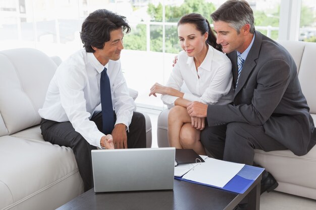 Business team looking at a laptop