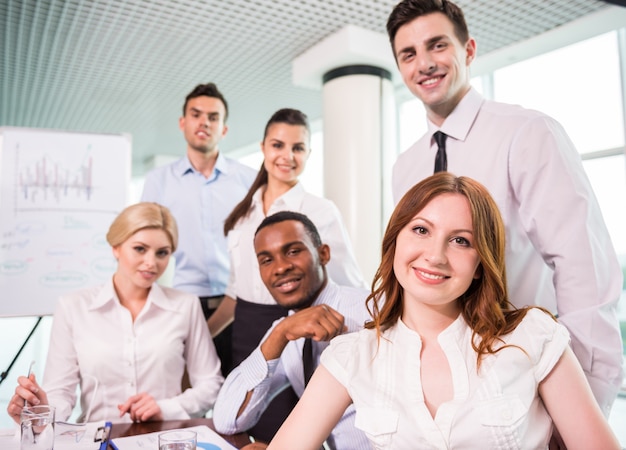 Business team at a meeting in a modern office environment.